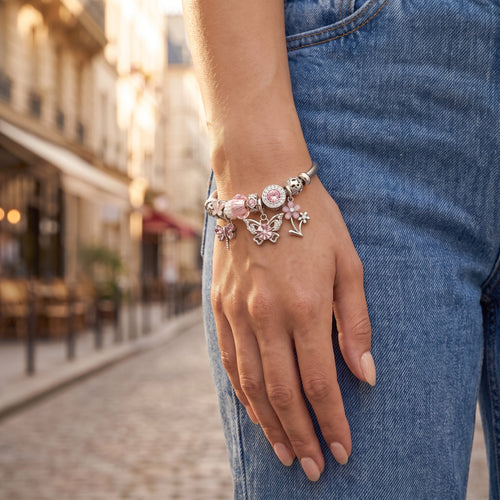 Blushline Pink Butterfly Twisted Cable Bangle worn on the wrist