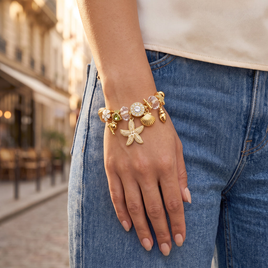 Rockpool Dual Tone Ocean Charm Bangle worn on the wrist