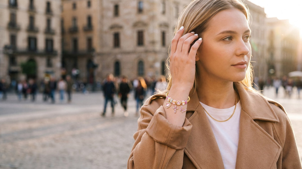 Charm bangle worn in a sunlit city square